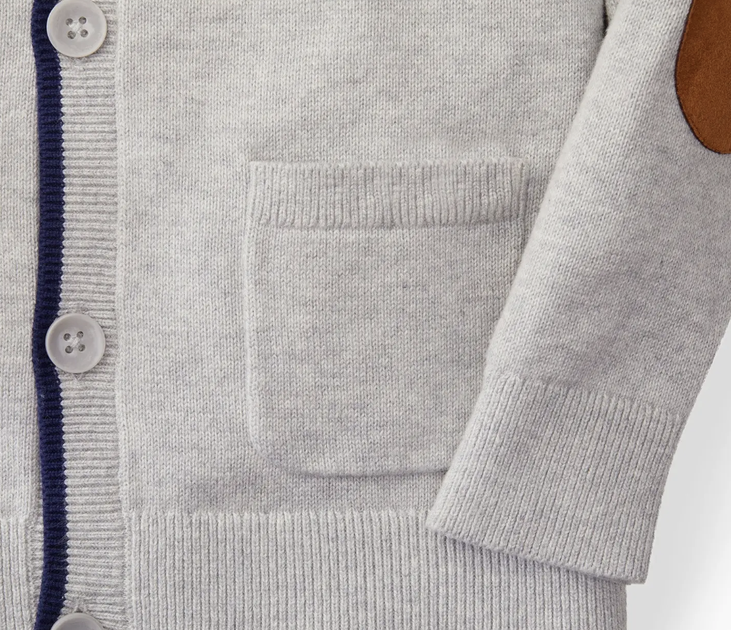 Gray cardigan with button details on a white background