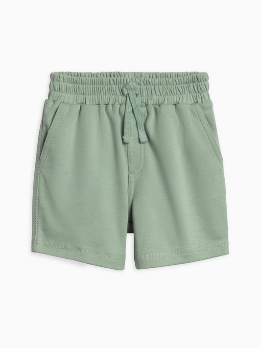 Green shorts with an elastic waistband on a white background